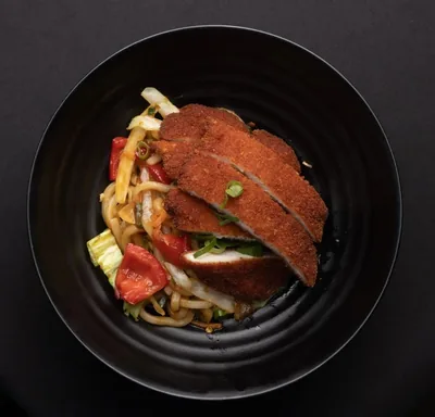 Stir fried yaki udon noodles with chicken katsu.