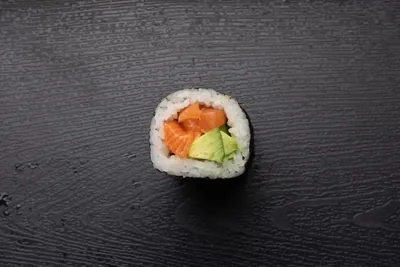 Fresh salmon and avocado sushi roll.