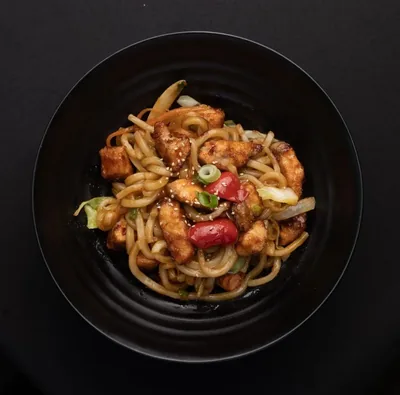 Teriyaki salmon yaki udon with vegetables.